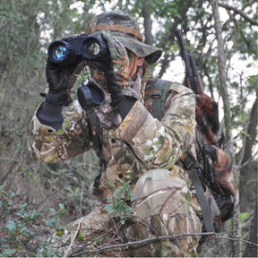 Hunter looking in binoculars.